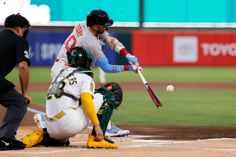 Sep 9, 2025; West Sacramento, California, USA; Boston Red Sox shortstop Trevor Story (10) singles during the first inning against the Athletics at Sutter Health Park. Mandatory Credit: Sergio Estrada-Imagn Images