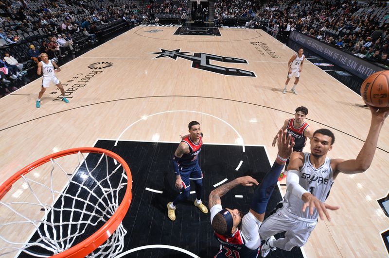SAN ANTONIO, TX - JANUARY 29:  Victor Wembanyama #1 of the San Antonio Spurs drives to the basket during the game  against the Washington Wizards on January 29, 2024 at the Frost Bank Center in San Antonio, Texas. NOTE TO USER: User expressly acknowledges and agrees that, by downloading and or using this photograph, user is consenting to the terms and conditions of the Getty Images License Agreement. Mandatory Copyright Notice: Copyright 2024 NBAE (Photos by Michael Gonzales/NBAE via Getty Images)