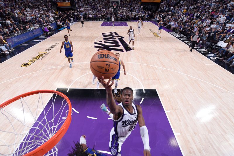 SACRAMENTO, CA - APRIL 16: Keon Ellis #23 of the Sacramento Kings drives to the basket during the game against the Golden State Warriors during the 2024 Play-In Tournament on April 16, 2024 at Golden 1 Center in Sacramento, California. NOTE TO USER: User expressly acknowledges and agrees that, by downloading and or using this Photograph, user is consenting to the terms and conditions of the Getty Images License Agreement. Mandatory Copyright Notice: Copyright 2024 NBAE (Photo by Rocky Widner/NBAE via Getty Images)