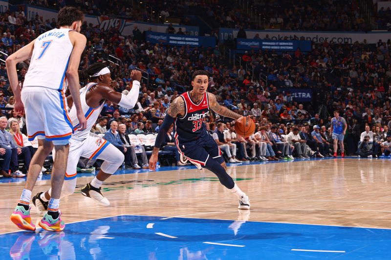 OKLAHOMA CITY, OK - FEBRUARY 23: Kyle Kuzma #33 of the Washington Wizards handles the ball during the game against the Oklahoma City Thunder on February 23, 2024 at Paycom Arena in Oklahoma City, Oklahoma. NOTE TO USER: User expressly acknowledges and agrees that, by downloading and or using this photograph, User is consenting to the terms and conditions of the Getty Images License Agreement. Mandatory Copyright Notice: Copyright 2024 NBAE (Photo by Zach Beeker/NBAE via Getty Images)