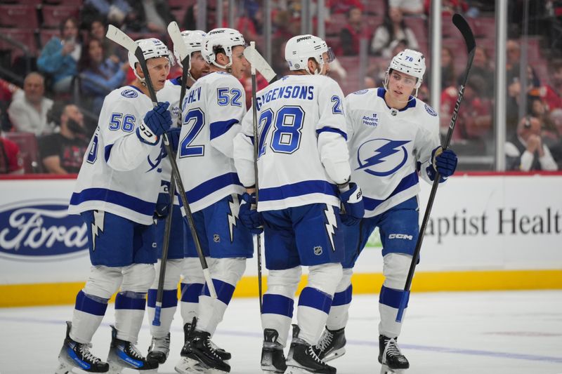 Sep 30, 2024; Sunrise, Florida, USA; Tampa Bay Lightning defenseman Emil Lilleberg (78) celebrates a goal against the Florida Panthers with teammates during the first period at Amerant Bank Arena. Mandatory Credit: Jim Rassol-Imagn Images