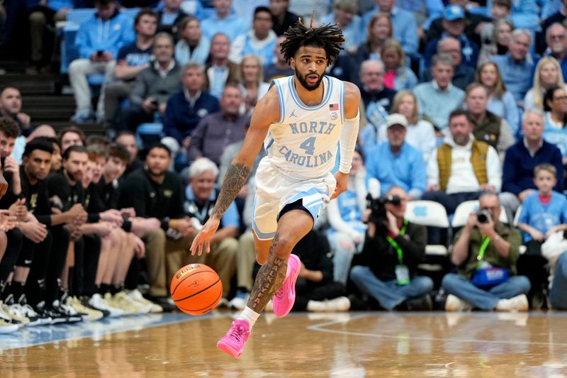 Jan 22, 2024; Chapel Hill, North Carolina, USA;  North Carolina Tar Heels guard RJ Davis (4) on the fast break in the second half at Dean E. Smith Center. Mandatory Credit: Bob Donnan-USA TODAY Sports