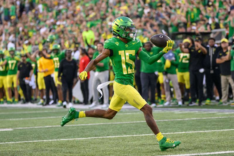 Sep 16, 2023; Eugene, Oregon, USA; Oregon Ducks wide receiver Tez Johnson (15) scores a touchdown during the third quarter against the Hawaii Warriors at Autzen Stadium. Mandatory Credit: Craig Strobeck-USA TODAY Sports