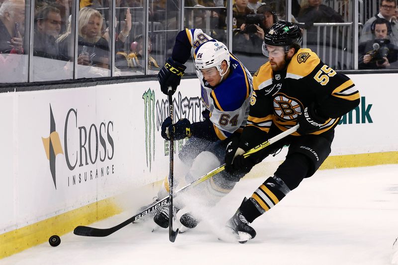 Nov 16, 2024; Boston, Massachusetts, USA; St. Louis Blues defenseman Corey Schueneman (64) and Boston Bruins right wing Justin Brazeau (55) battle for the puck during the third period at TD Garden. Mandatory Credit: Winslow Townson-Imagn Images