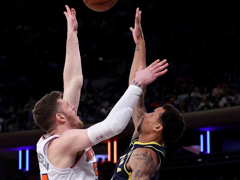 NEW YORK, NEW YORK - APRIL 09: Isaiah Hartenstein #55 of the New York Knicks takes a shot as George Hill #7 of the Indiana Pacers defends at Madison Square Garden on April 09, 2023 in New York City. NOTE TO USER: User expressly acknowledges and agrees that, by downloading and or using this photograph, User is consenting to the terms and conditions of the Getty Images License Agreement. (Photo by Elsa/Getty Images)