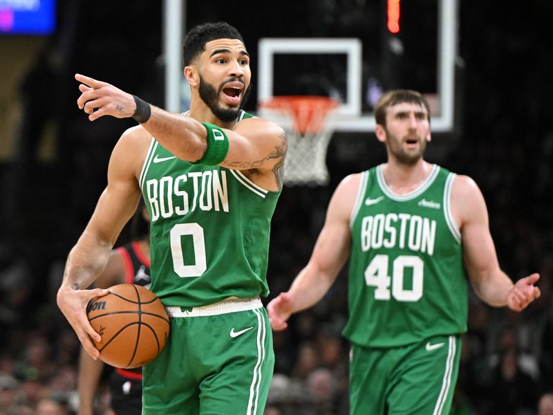 BOSTON, MASSACHUSETTS - JANUARY 29: Jayson Tatum #0 and Luke Kornet #40 of the Boston Celtics react after a foul during the fourth quarter of a game against the Chicago Bulls at the TD Garden on January 29, 2025 in Boston, Massachusetts. NOTE TO USER: User expressly acknowledges and agrees that, by downloading and or using this photograph, User is consenting to the terms and conditions of the Getty Images License Agreement. (Photo by Brian Fluharty/Getty Images)