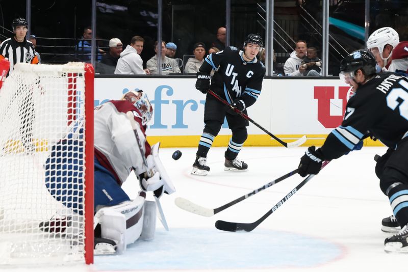 Oct 24, 2024; Salt Lake City, Utah, USA; Utah Hockey Club center Clayton Keller (9) takes a shot on against Colorado Avalanche goaltender Justus Annunen (60) during the second period at Delta Center. Mandatory Credit: Rob Gray-Imagn Images