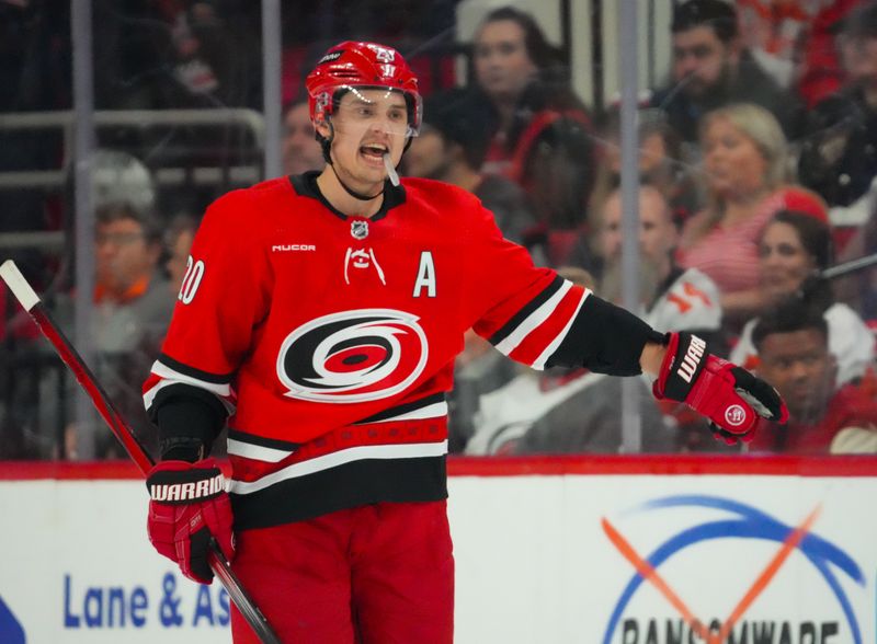 Mar 21, 2024; Raleigh, North Carolina, USA; Carolina Hurricanes center Sebastian Aho (20) reacts against the Philadelphia Flyers during the first period at PNC Arena. Mandatory Credit: James Guillory-USA TODAY Sports