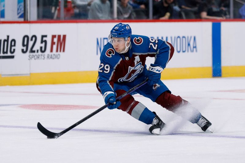 Oct 5, 2022; Denver, Colorado, USA; Colorado Avalanche center Nathan MacKinnon (29) controls the puck in the second period against the Dallas Stars at Ball Arena. Mandatory Credit: Isaiah J. Downing-USA TODAY Sports