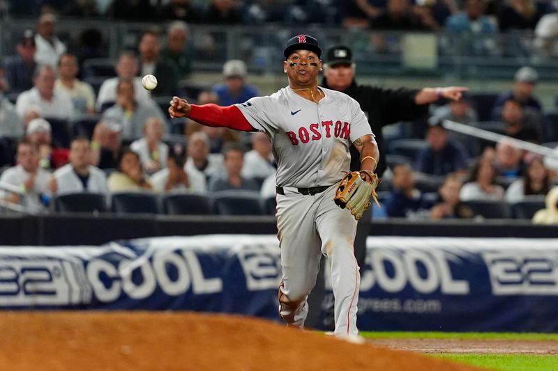 Sep 12, 2024; Bronx, New York, USA; Boston Red Sox third baseman Rafael Devers (11) throws out New York Yankees shortstop Anthony Volpe (not pictured) after fielding a ground ball during the ninth inning at Yankee Stadium. Mandatory Credit: Gregory Fisher-Imagn Images