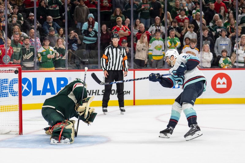 Oct 12, 2024; Saint Paul, Minnesota, USA; Seattle Kraken right wing Oliver Bjorkstrand (22) scores against Minnesota Wild goaltender Marc-Andre Fleury (29) for the first goal in the shootout at Xcel Energy Center. Mandatory Credit: Matt Blewett-Imagn Images