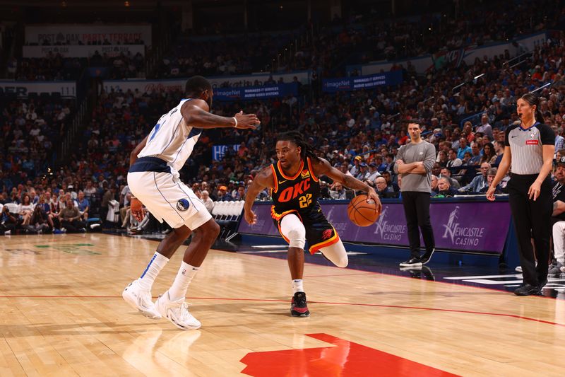 OKLAHOMA CITY, OK - APRIL 14:Cason Wallace #22 of the Oklahoma City Thunder  dribbles the ball during the game against the Dallas Mavericks  on April 14, 2024 at Paycom Arena in Oklahoma City, Oklahoma. NOTE TO USER: User expressly acknowledges and agrees that, by downloading and or using this photograph, User is consenting to the terms and conditions of the Getty Images License Agreement. Mandatory Copyright Notice: Copyright 2024 NBAE (Photo by Zach Beeker/NBAE via Getty Images)