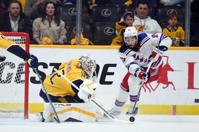 Dec 2, 2023; Nashville, Tennessee, USA; Nashville Predators goaltender Kevin Lankinen (32) knocks the puck away from New York Rangers center Mika Zibanejad (93) during the third period at Bridgestone Arena. Mandatory Credit: Christopher Hanewinckel-USA TODAY Sports