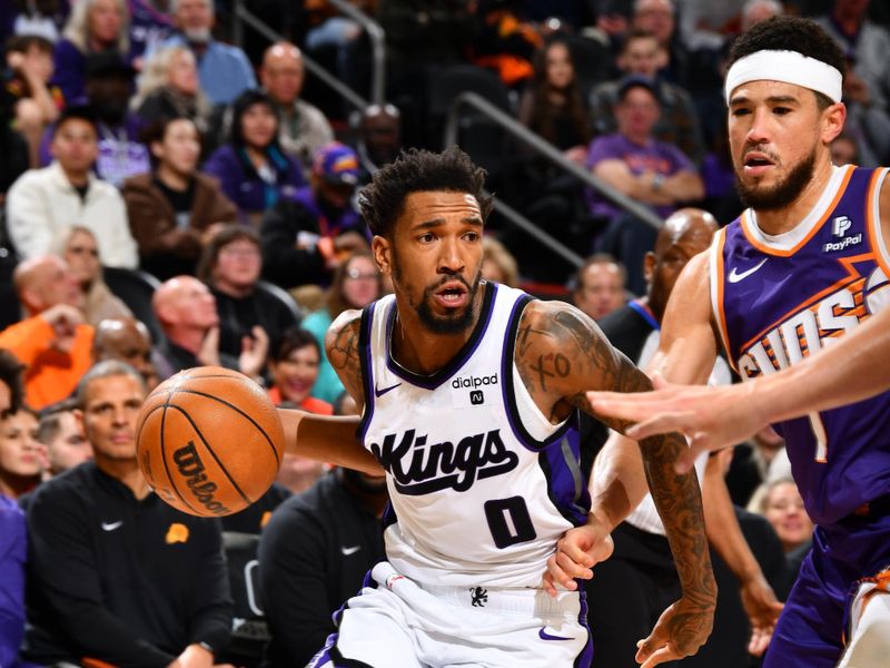 PHOENIX, AZ - FEBRUARY 13:  Malik Monk #0 of the Sacramento Kings handles the ball during the game against the Phoenix Suns on February 13, 2024 at Footprint Center in Phoenix, Arizona. NOTE TO USER: User expressly acknowledges and agrees that, by downloading and or using this photograph, user is consenting to the terms and conditions of the Getty Images License Agreement. Mandatory Copyright Notice: Copyright 2024 NBAE (Photo by Barry Gossage/NBAE via Getty Images)