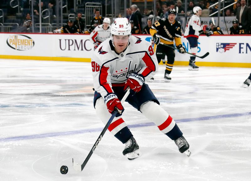 Mar 7, 2024; Pittsburgh, Pennsylvania, USA; Washington Capitals right wing Nicolas Aube-Kubel (96) handles the puck against the Pittsburgh Penguins during the second period at PPG Paints Arena. Mandatory Credit: Charles LeClaire-USA TODAY Sports