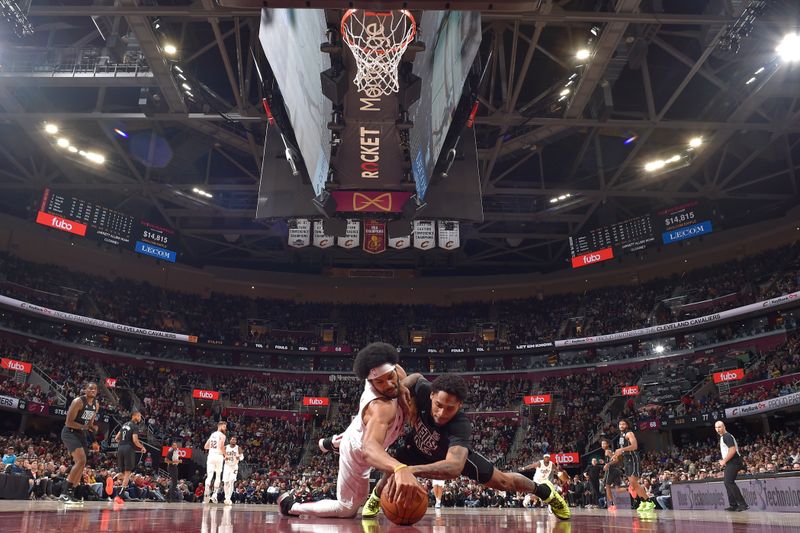 CLEVELAND, OH - NOVEMBER 9: Jarrett Allen #31 of the Cleveland Cavaliers and Keon Johnson #45 of the Brooklyn Nets battle for a loose ball during the game on November 9, 2024 at Rocket Mortgage FieldHouse in Cleveland, Ohio. NOTE TO USER: User expressly acknowledges and agrees that, by downloading and/or using this Photograph, user is consenting to the terms and conditions of the Getty Images License Agreement. Mandatory Copyright Notice: Copyright 2024 NBAE (Photo by David Liam Kyle/NBAE via Getty Images)