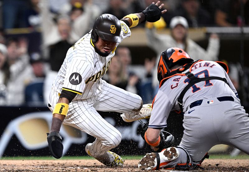 Sep 16, 2024; San Diego, California, USA; San Diego Padres designated hitter Luis Arraez (4) is tagged out at home by Houston Astros catcher Victor Caratini (17) during the fifth inning at Petco Park. Mandatory Credit: Orlando Ramirez-Imagn Images