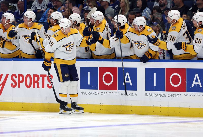 Oct 10, 2023; Tampa, Florida, USA; Nashville Predators center Juuso Parssinen (75) is congratulated after he scored a goal against the Tampa Bay Lightning during the third period at Amalie Arena. Mandatory Credit: Kim Klement Neitzel-USA TODAY Sports