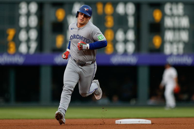Aug 5, 2025; Denver, Colorado, USA; Toronto Blue Jays center fielder Daulton Varsho (5) rounds the bases on a two run home run in the fourth inning against the Colorado Rockies at Coors Field. Mandatory Credit: Isaiah J. Downing-Imagn Images
