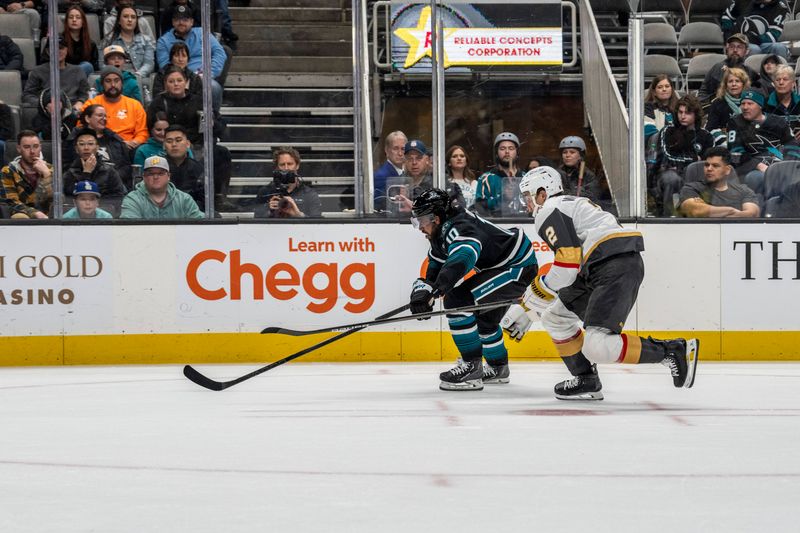 Feb 19, 2024; San Jose, California, USA; San Jose Sharks left wing Anthony Duclair (10) and Vegas Golden Knights defenseman Zach Whitecloud (2) skate for the puck during the first period at SAP Center at San Jose. Mandatory Credit: Neville E. Guard-USA TODAY Sports