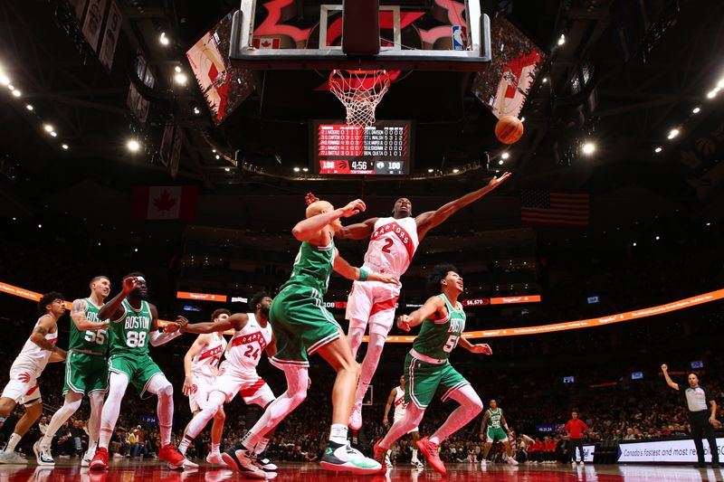 TORONTO, CANADA - OCTOBER 15: Jonathan Mogbo #2 of the Toronto Raptors goes for rebound against the Boston Celtics on October 15, 2024 at the Scotiabank Arena in Toronto, Ontario, Canada.  NOTE TO USER: User expressly acknowledges and agrees that, by downloading and or using this Photograph, user is consenting to the terms and conditions of the Getty Images License Agreement.  Mandatory Copyright Notice: Copyright 2024 NBAE (Photo by Vaughn Ridley/NBAE via Getty Images)