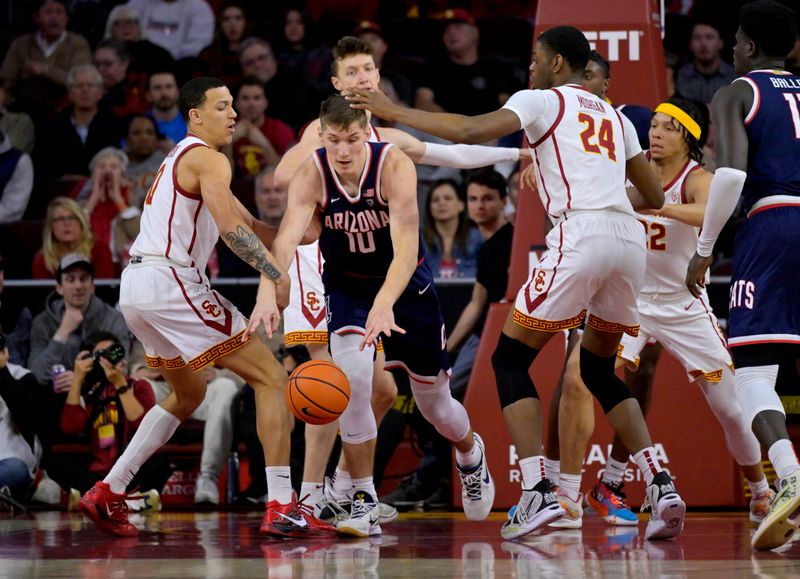 Mar 2, 2023; Los Angeles, California, USA;  USC Trojans forward Kobe Johnson (0) and forward Joshua Morgan (24) defend a rebound by Arizona Wildcats forward Azuolas Tubelis (10) in the first half at Galen Center. Mandatory Credit: Jayne Kamin-Oncea-USA TODAY Sports