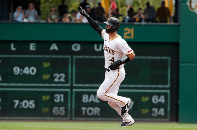 Aug 8, 2024; Pittsburgh, Pennsylvania, USA;  Pittsburgh Pirates catcher Joey Bart (14) runs the bases after hitting a two run home run against the San Diego Padres during the seventh inning at PNC Park. Mandatory Credit: Charles LeClaire-USA TODAY Sports