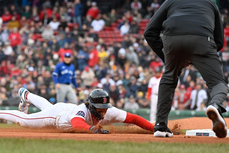 Apr 10, 2025; Boston, Massachusetts, USA; Boston Red Sox left fielder Jarren Duran (16) slides safe into third base against the Toronto Blue Jays during the sixth inning at Fenway Park. Mandatory Credit: Eric Canha-Imagn Images
