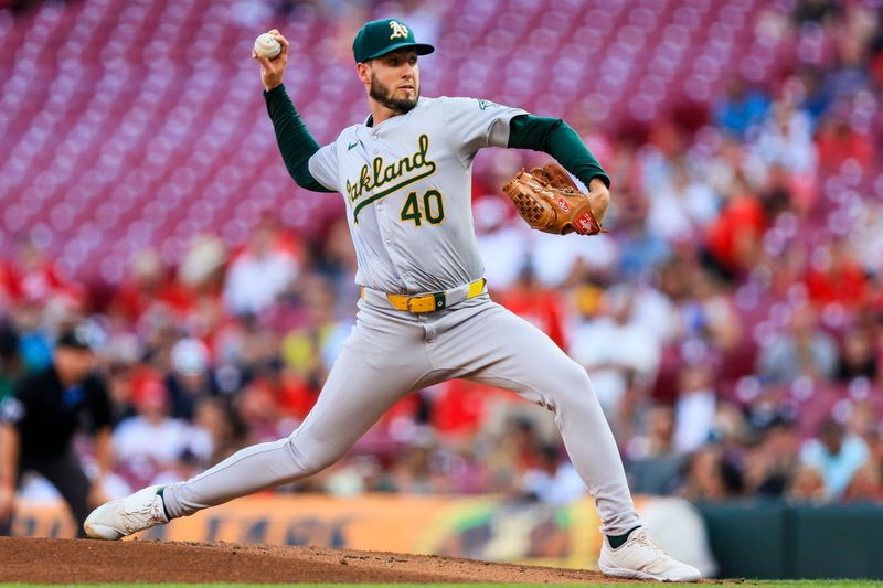 Aug 27, 2024; Cincinnati, Ohio, USA; Oakland Athletics starting pitcher Mitch Spence (40) pitches against the Cincinnati Reds in the first inning at Great American Ball Park. Mandatory Credit: Katie Stratman-USA TODAY Sports