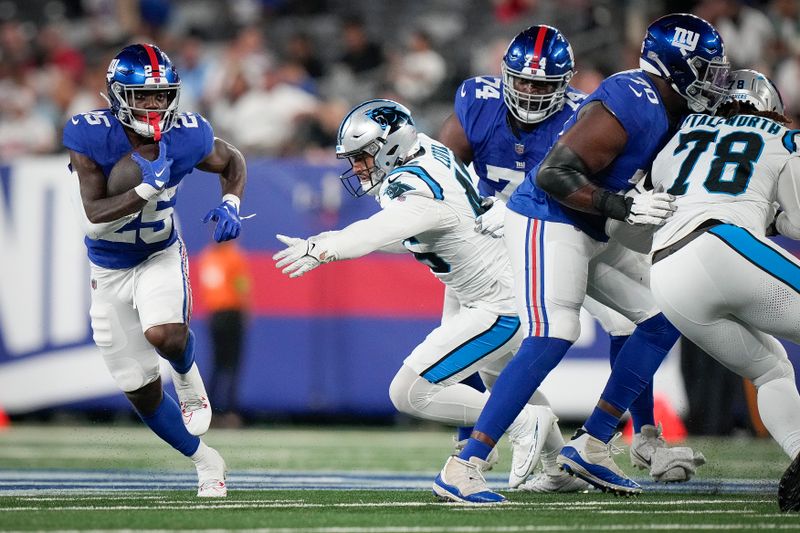 New York Giants running back Jashaun Corbin runs with the ball during an NFL preseason football game against the Carolina Panthers, Friday, Aug. 18, 2023, in East Rutherford, N.J. (AP Photo/Bryan Woolston)