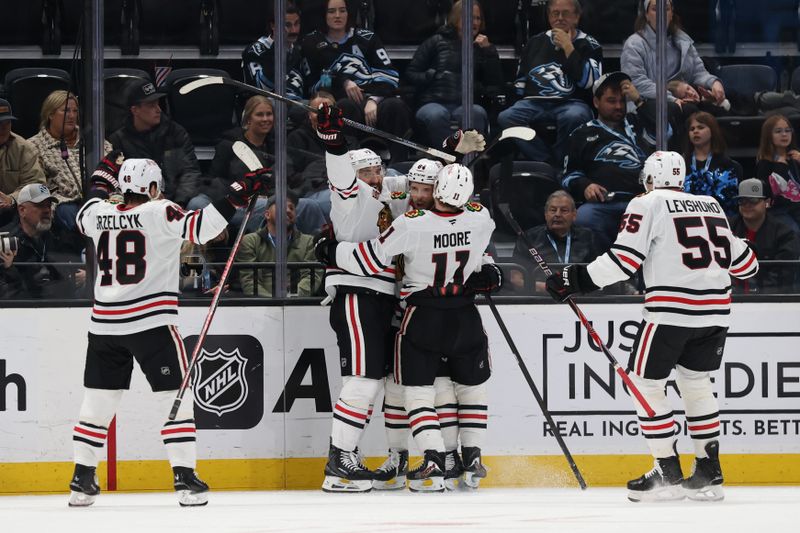 Mar 1, 2026; Salt Lake City, Utah, USA; The Chicago Blackhawks celebrate a goal by left wing Landon Slaggert (84) against the Utah Mammoth during the second period at Delta Center. Mandatory Credit: Rob Gray-Imagn Images