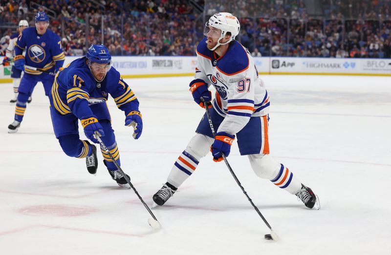 Mar 9, 2024; Buffalo, New York, USA;  Buffalo Sabres center Tyson Jost (17) tries to block a shot by Edmonton Oilers center Connor McDavid (97) during the first period at KeyBank Center. Mandatory Credit: Timothy T. Ludwig-USA TODAY Sports