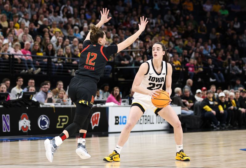 Mar 4, 2023; Minneapolis, MINN, USA; Iowa Hawkeyes guard Caitlin Clark (22) looks to pass while Maryland Terrapins guard Elisa Pinzan (12) defends during the first half at Target Center. Mandatory Credit: Matt Krohn-USA TODAY Sports