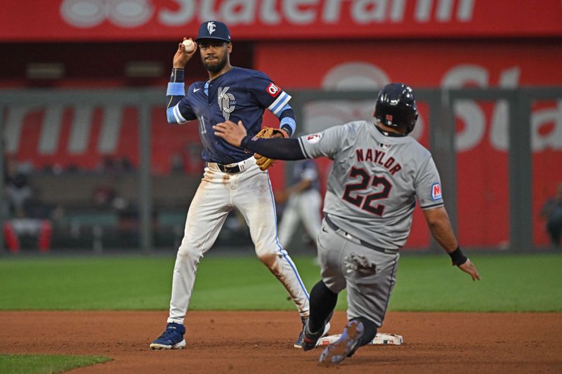 Jun 28, 2024; Kansas City, Missouri, USA;  Kansas City Royals second baseman Maikel Garcia (11) throws to first base for a double play after forcing out Cleveland Guardians Josh Naylor (22) in the third inning at Kauffman Stadium. Mandatory Credit: Peter Aiken-USA TODAY Sports