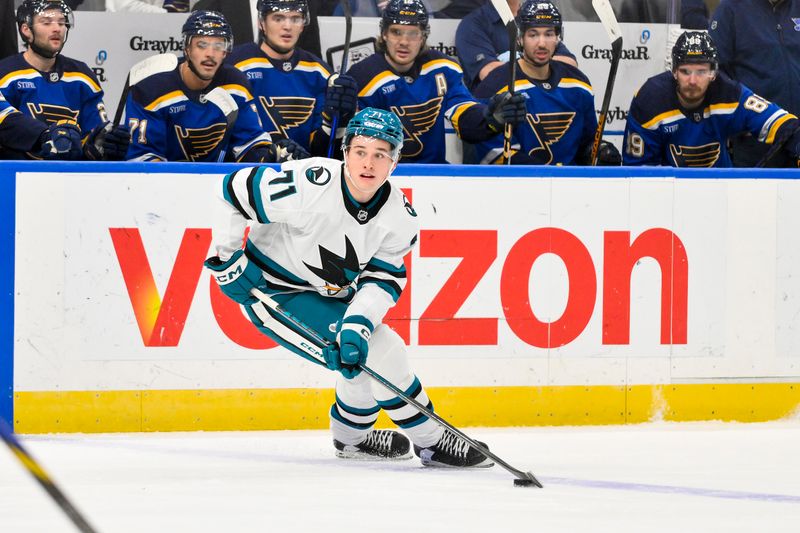 Nov 21, 2024; St. Louis, Missouri, USA;  San Jose Sharks center Macklin Celebrini (71) controls the puck against the St. Louis Blues during the first period at Enterprise Center. Mandatory Credit: Jeff Curry-Imagn Images