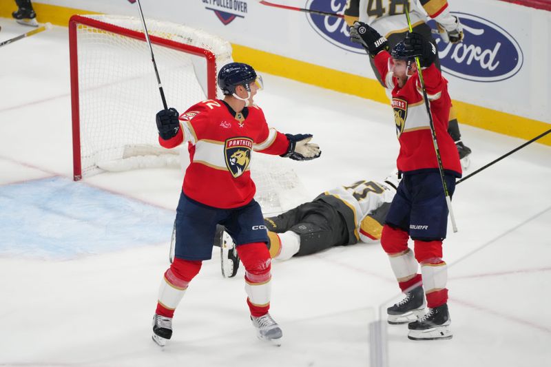 Oct 19, 2024; Sunrise, Florida, USA;  Florida Panthers defenseman Gustav Forsling (42) celebrates with center Sam Bennett (9) after a goal against the Vegas Golden Knights during overtime at Amerant Bank Arena. Mandatory Credit: Jim Rassol-Imagn Images