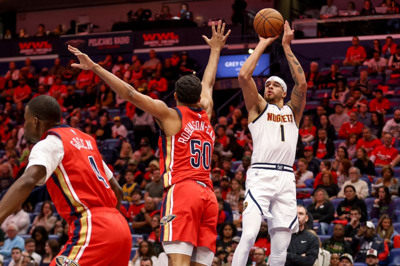 NEW ORLEANS, LOUISIANA - NOVEMBER 15:  Michael Porter Jr. #1 of the Denver Nuggets shoots over Jeremiah Robinson-Earl #50 of the New Orleans Pelicans during the first half of an Emirates NBA Cup game at the Smoothie King Center on November 15, 2024 in New Orleans, Louisiana. NOTE TO USER: User expressly acknowledges and agrees that, by downloading and or using this photograph, User is consenting to the terms and conditions of the Getty Images License Agreement. (Photo by Derick E. Hingle/Getty Images)