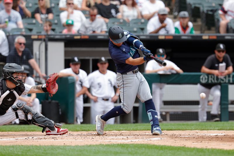 Jul 28, 2024; Chicago, Illinois, USA; Seattle Mariners shortstop Leo Rivas (76) hits an RBI-single against the Chicago White Sox during the second inning at Guaranteed Rate Field. Mandatory Credit: Kamil Krzaczynski-USA TODAY Sports