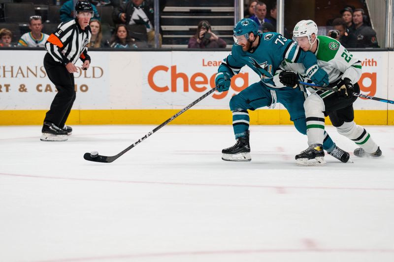 Jan 18, 2023; San Jose, California, USA; San Jose Sharks center Noah Gregor (73) shoots the puck while battling Dallas Stars defenseman Esa Lindell (23) during the second period at SAP Center at San Jose. Mandatory Credit: Neville E. Guard-USA TODAY Sports