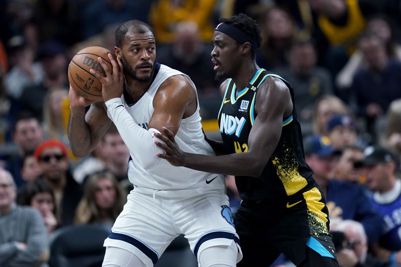 INDIANAPOLIS, INDIANA - JANUARY 28: Xavier Tillman #2 of the Memphis Grizzlies handles the ball while being guarded by Pascal Siakam #43 of the Indiana Pacers in the second quarter at Gainbridge Fieldhouse on January 28, 2024 in Indianapolis, Indiana. NOTE TO USER: User expressly acknowledges and agrees that, by downloading and or using this photograph, User is consenting to the terms and conditions of the Getty Images License Agreement. (Photo by Dylan Buell/Getty Images)