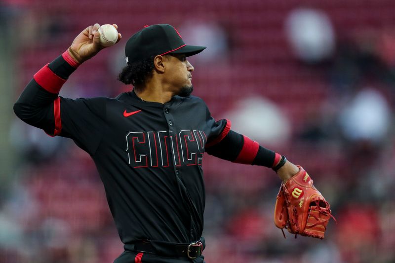 Apr 5, 2024; Cincinnati, Ohio, USA; Cincinnati Reds third base Santiago Espinal (4) throws to first to get New York Mets right fielder Starling Marte (not pictured) out in the fourth inning at Great American Ball Park. Mandatory Credit: Katie Stratman-USA TODAY Sports