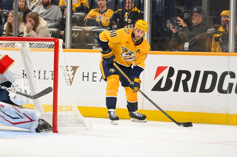Nov 24, 2025; Nashville, Tennessee, USA;  Nashville Predators center Ryan O'Reilly (90) skates behind the net against the Florida Panthers during the third period at Bridgestone Arena. Mandatory Credit: Steve Roberts-Imagn Images