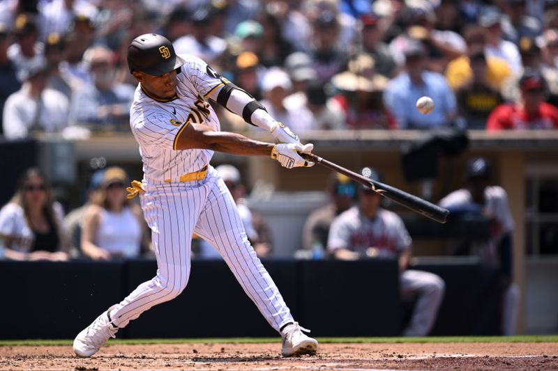 Apr 19, 2023; San Diego, California, USA; San Diego Padres right fielder Jose Azocar (28) hits a single against the Atlanta Braves during the third inning at Petco Park. Mandatory Credit: Orlando Ramirez-USA TODAY Sports