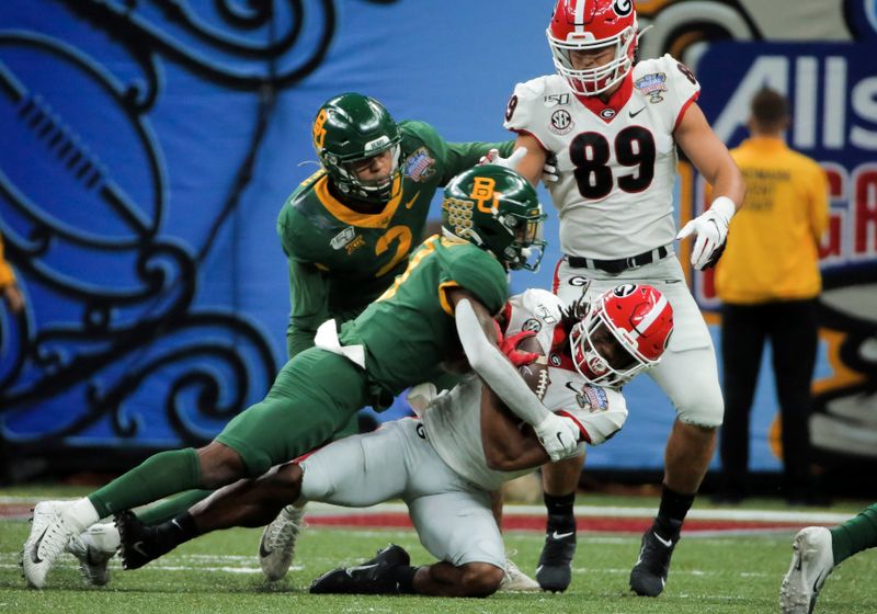 Jan 1, 2020; New Orleans, Louisiana, USA;  Baylor Bears safety Chris Miller (3) tackles Georgia Bulldogs running back James Cook (4) during the first quarter of the Sugar Bowl at the Mercedes-Benz Superdome. Mandatory Credit: Derick E. Hingle-USA TODAY Sports