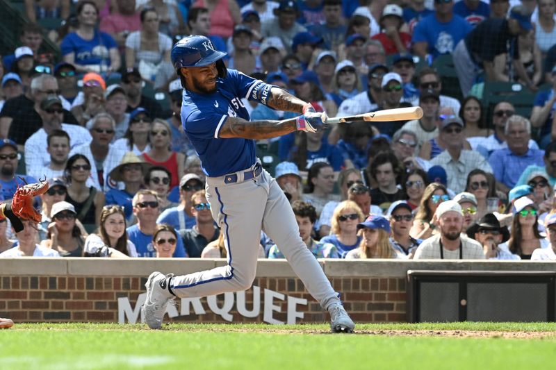 Aug 20, 2023; Chicago, Illinois, USA;  Kansas City Royals third baseman Maikel Garcia (11) hits an RBI single against the Chicago Cubs during the ninth inning at Wrigley Field. Mandatory Credit: Matt Marton-USA TODAY Sports