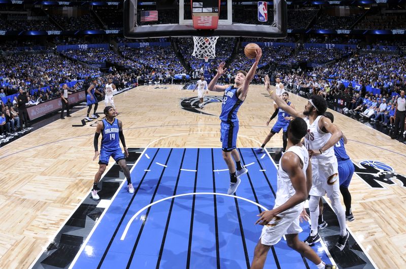 ORLANDO, FL - APRIL 27: Franz Wagner #22 of the Orlando Magic drives to the basket during the game against the Cleveland Cavaliers during Round 1 Game 4 of the 2024 NBA Playoffs on April 27, 2024 at the Kia Center in Orlando, Florida. NOTE TO USER: User expressly acknowledges and agrees that, by downloading and or using this photograph, User is consenting to the terms and conditions of the Getty Images License Agreement. Mandatory Copyright Notice: Copyright 2024 NBAE (Photo by Fernando Medina/NBAE via Getty Images)