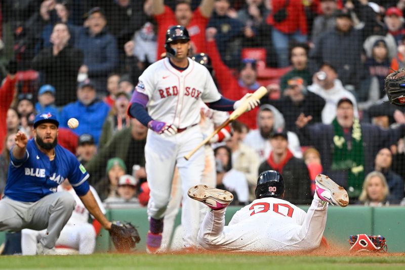 Apr 10, 2025; Boston, Massachusetts, USA; Boston Red Sox outfielder Rob Refsnyder (30) scores on a wild pitch against the Toronto Blue Jays during the eighth inning at Fenway Park. Mandatory Credit: Eric Canha-Imagn Images
