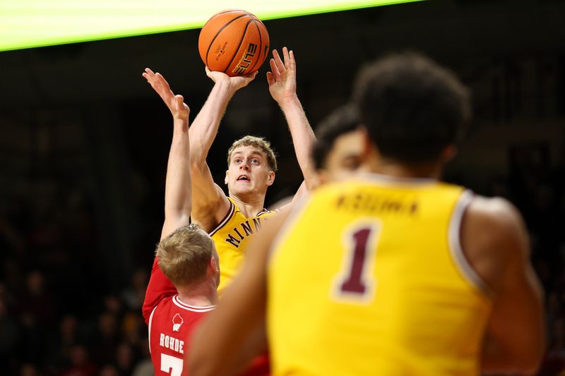 Jan 13, 2026; Minneapolis, Minnesota, USA; Minnesota Golden Gophers forward Cade Tyson (10) shoots over Wisconsin Badgers guard Andrew Rohde (7) during the first half at Williams Arena. Mandatory Credit: Matt Krohn-Imagn Images
