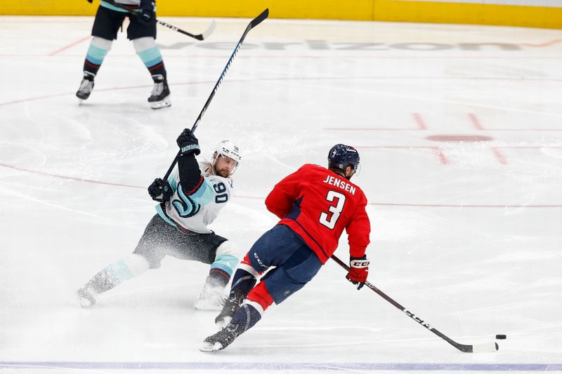 Jan 11, 2024; Washington, District of Columbia, USA; Washington Capitals defenseman Nick Jensen (3) skates with the puck as Seattle Kraken left wing Tomas Tatar (90) chases in the second period at Capital One Arena. Mandatory Credit: Geoff Burke-USA TODAY Sports