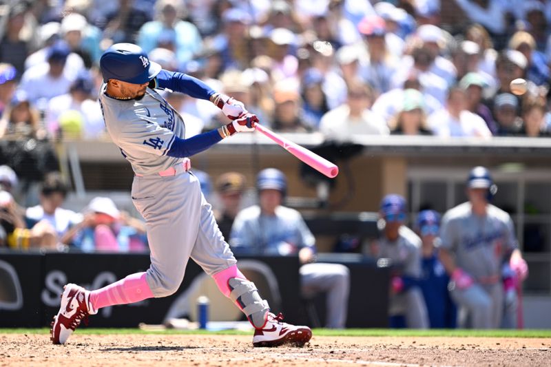 May 12, 2024; San Diego, California, USA; Los Angeles Dodgers shortstop Mookie Betts (50) hits a double against the San Diego Padres during the sixth inning at Petco Park. Mandatory Credit: Orlando Ramirez-USA TODAY Sports